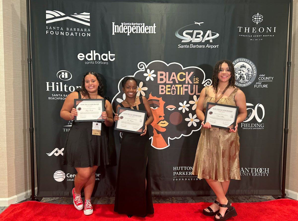 From left to right: Sophomore Hope Smith, freshman Zoe Rogers and junior Ava Allen pose at the Black is Beautiful Gala with their awards 