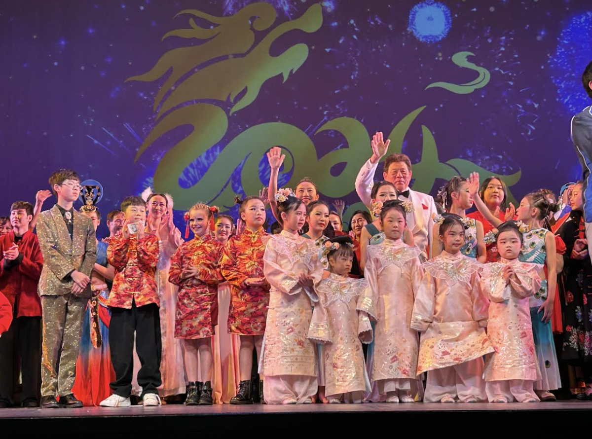 Children performed at The Marjorie Luke Theatre in celebration of Chinese New Year. They waive goodbye to the audience after their performance. 