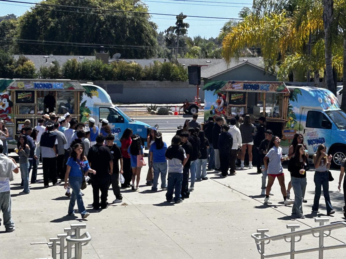 San Marcos freshmen eating Kona Ice at freshman orientation 