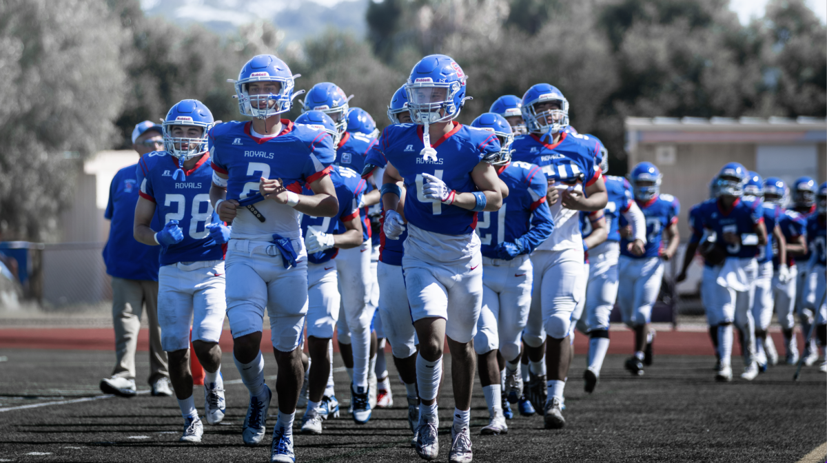 San Marcos JV Football team marching out to face Beckman High School