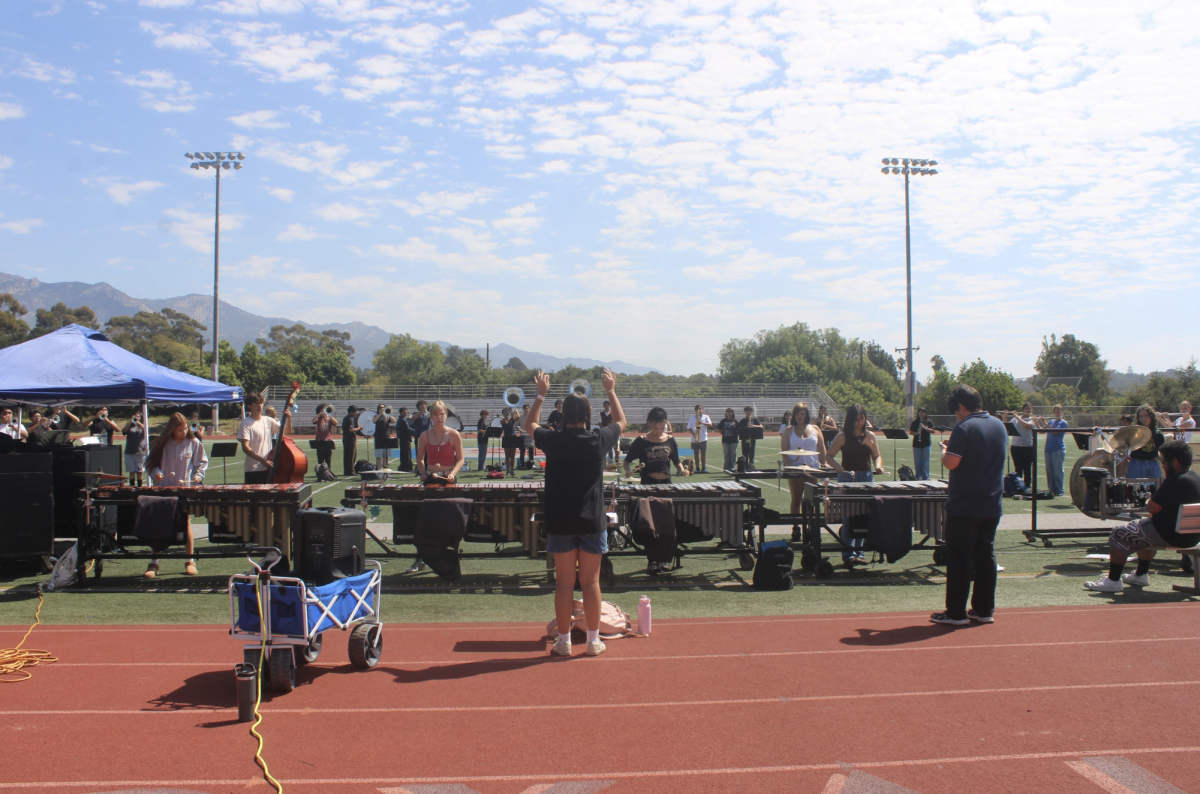 The San Marcos marching band, hard at work while practicing their show music. 