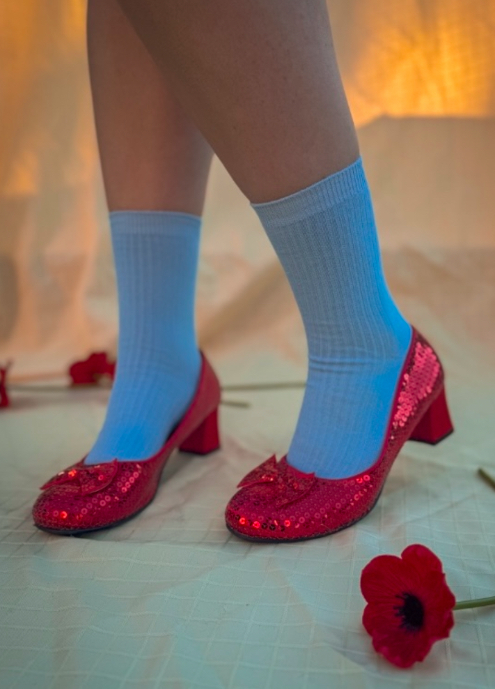 Dorothy’s iconic ruby red slippers ready to walk down the yellow brick road.