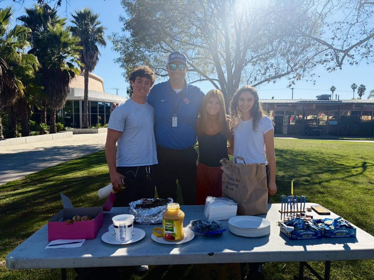 Jewish Club presidents gather with Mr. Sheldon during the December 11th Hanukkah Celebration.